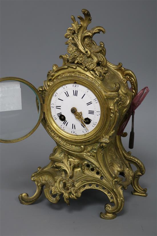 A 19th century gilt rococo style striking mantel clock height 29cm